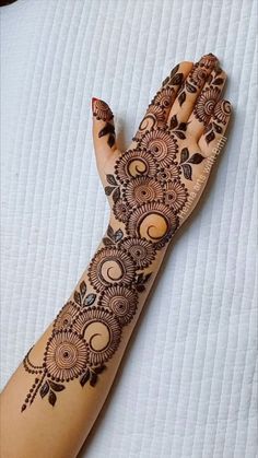 a henna tattoo on someone's hand