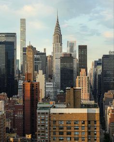 the city skyline is shown with skyscrapers and other tall buildings in the foreground