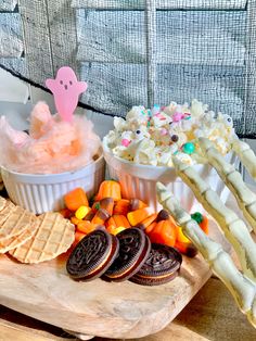 an assortment of halloween treats and snacks on a tray