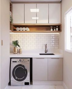 a washer and dryer in a small kitchen