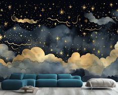 a living room with stars and clouds painted on the wall, along with a blue couch