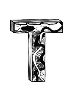 the letter t is made out of wood and has an intricate design on it's side