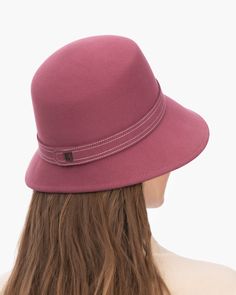 A fashionable women's cloche hat is hand-blocked of the finest superfelt, and then trimmed with a contrast stitch matching band of the same. The ultra sleek silhouette features a rakishly downturned brim, bringing focus to the eyes while framing the face beautifully. Brim span center front: 2.75"(7cm) side: 3"(7.5cm) Designed and finished in the USA Hand-blocked by skilled artisans Sustainable wool and cashmere blend superfelt Elasticized sweatband Adjustable head-size with hidden velcro® featur Adjustable Fur Felt Cloche Hat With Flat Brim, Formal Brimmed Fedora, Fall Cloche Hat With Short Brim In Fur Felt, Fall Wide Brim Fur Felt Cloche Hat, Fur Felt Cloche Hat With Short Brim For Fall, Chic Brimmed Cloche Hat, Chic Fitted Cloche Hat With Flat Brim, Elegant Wool Felt Hat, Fitted Cloche Hat With Curved Brim