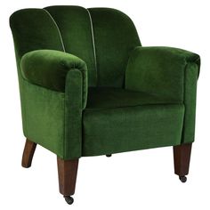 a green chair sitting on top of a wooden leg rest with white piping down the side