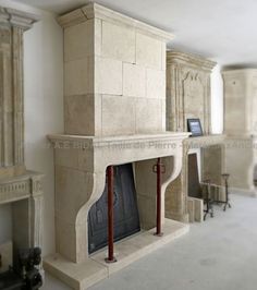 a fireplace in the middle of a living room