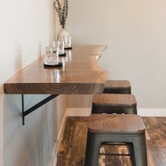 two stools and a table in a room