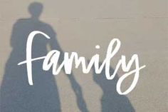 the shadow of a man and woman holding hands with the word family written on it