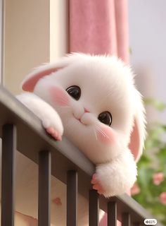 a white cat with big eyes is leaning on the railing