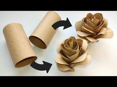 three rolls of toilet paper with one rolled up and the other rolled down to make a flower