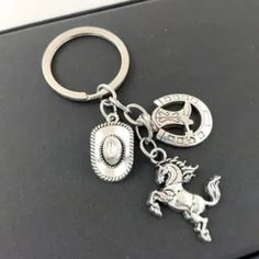 1pc. Sporty Western Cowboy Hat & Boots Keychain. Fashionable Stylish Keychain With All The Charms. Silver-Tone Charms Unique Pendant Key-Ring. Brand New. Western Cowboy Hats, Boots Cowboy, Unique Pendant, Cowboy Hat, Western Cowboy, Key Ring, Key Rings, Cowboy Hats, New Color