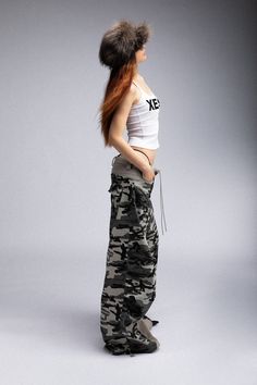 Description: The Double-Waist Spliced Camo Wide-Leg Pants seamlessly blend casual street vibes with sophisticated craftsmanship. Featuring a bold spliced design, these pants consist of a light gray inner crotch with camo on the outside, creating a unique, standout look. Both the front and back feature dual pockets, providing ample storage space. The adjustable drawstring waist and adjustable leg openings offer a customizable fit, ensuring comfort and versatility. Made from premium fabric, these Camuflage Outfit Pants, Baggy Pants Outfit, Street Vibes, Camo Fabric, Adjustable Legs, Baggy Pant, Brand Sale, Layers Design, Accessories Branding