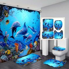 the bathroom is decorated in blue and has dolphins on it