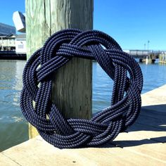 a blue rope is tied to a wooden post