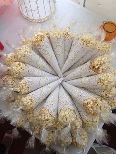 a bunch of popcorn sitting on top of a table next to a birdcage