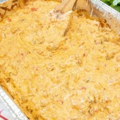 a casserole dish with meat and cheese in it