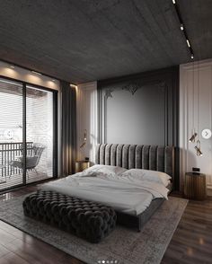 a large bed sitting on top of a wooden floor