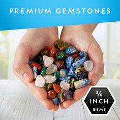 two hands holding small rocks with the words premium gemstones