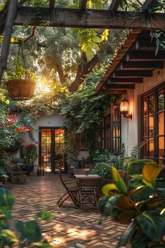 an outdoor patio with tables and chairs surrounded by greenery