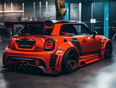 an orange sports car parked in a garage