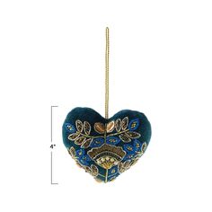 a blue heart shaped ornament hanging from a gold chain