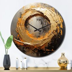 a clock that is on the wall next to a vase with flowers in front of it