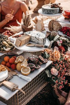 a table topped with lots of different types of cakes and desserts on top of it