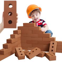 a small child is playing with bricks