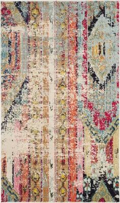 an old rug with many different colors and patterns