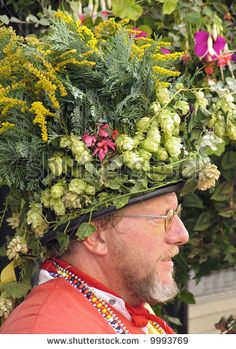 a man wearing a flower crown on his head