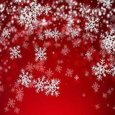 red and white snowflakes are falling down on the ground, as if they were in