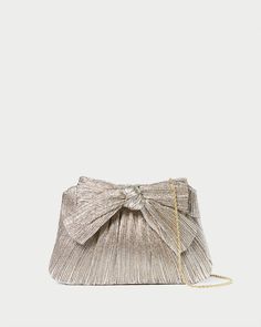 Color: Champagne Clutch With Strap, Chic Bow Evening Bag For Party, Elegant Bags With Bow For Events, Chic Party Evening Bag With Bow, Elegant Metallic Rectangular Evening Bag, Elegant Evening Bag With Bow, Luxury Gold Clutch For Cocktail, Elegant Metallic Evening Bag, Elegant Bags With Bow For Party