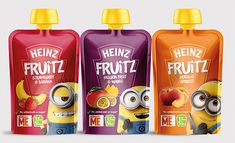 three bottles of fruit juice with characters on them