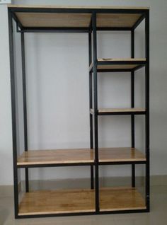 an open shelving unit with wooden shelves and black metal bars on the bottom shelf