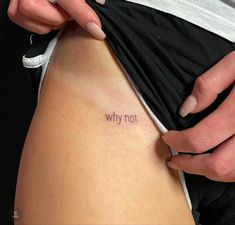 a woman is holding her stomach with the word why not written on it in black ink