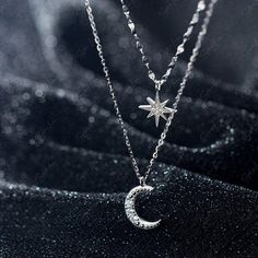 Indulge in the mesmerizing beauty of our double layer celestial pendant necklace, crafted with utmost care from luxurious 925 sterling silver and adorned with sparkling cubic zirconia pave. This exquisite piece features a shorter choker length necklace with a dazzling star charm and a longer crescent moon necklace. Elevate your jewelry collection with this delicate yet captivating moon and star necklace, perfect for everyday wear or as a heartfelt gift for your loved ones. Materials: 925 sterlin Necklace Moon And Star, Silver Celestial Jewelry, Celestial Silver Diamond Necklace Gift, Celestial Style Silver Diamond Necklace Gift, Silver Double Strand Diamond Jewelry, Celestial Style White Gold Necklace With Cubic Zirconia, Celestial Cubic Zirconia Pendant Necklace, Moon And Star Pendant, Silver Moon Necklace