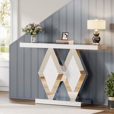 a modern console table with geometric shapes on it