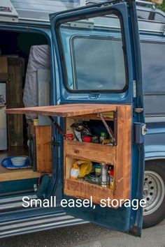 an open blue van door with food and drinks in it