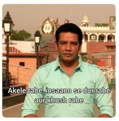 a man standing in front of a building with the words akele rahe insaano se dur rahe aur khush rahe