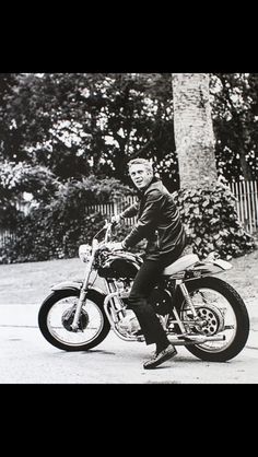 black and white photograph of a man on a motorcycle