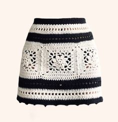 a crocheted skirt with black and white stripes