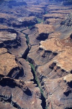 an aerial view of canyons and rivers in the desert