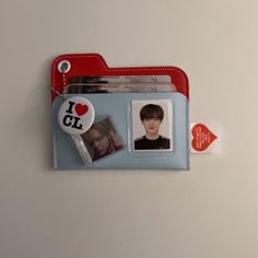 an id badge attached to a wallet with a photo and i love cll sticker on it