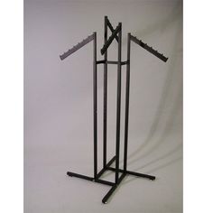 a pair of black metal clothes racks against a white background with no one in it