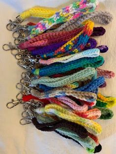 several crocheted key chains are lined up together