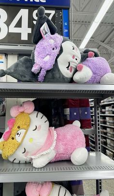 several stuffed animals are on shelves in a department store with price signs and prices above them