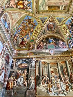 the ceiling is painted with many paintings on it