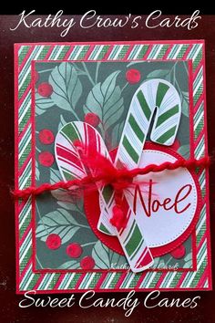 a christmas card with candy canes tied to it and the words noel on it