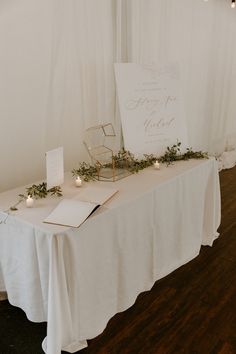 the table is set up with candles and cards