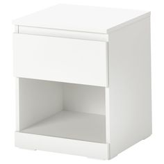 a white night stand with one drawer open