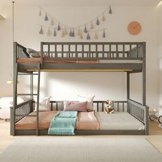 a bunk bed with two sets of ladders on the top and bottom, in front of a white wall